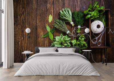 drying fresh herbs on wooden table Wall mural