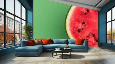 Watermelon Sliced in Half, Top View on Green Pastel Background Wall mural