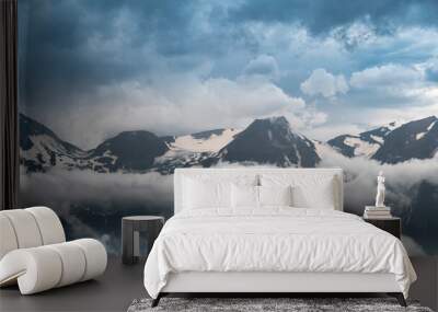 Wide Panorama of Grossglockner Peak in Austria Alps. Dramatic Mountain Above Clouds and Fog Wall mural