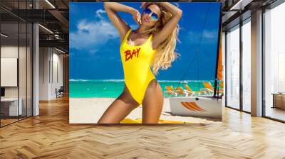 Incredibly beautiful sexy model girl in bikini at the seaside of the tropical island, blonde , bronze tan, travel summer vacation, fashion style, sexy lifeguard, surfer girl  - Image Wall mural