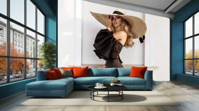 spring, summer fashion. high fashion model. glamour, stylish elegant woman in black jumpsuit and big Wall mural