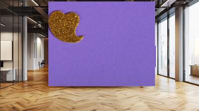 beautiful yellow heart on purple background, love concept Wall mural