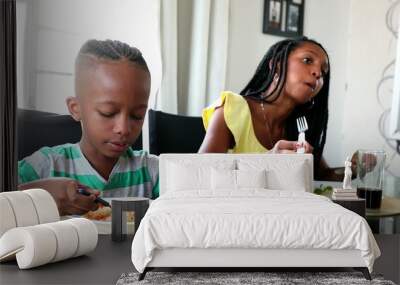 African family eating meal, child drinking soda beverage at lunch Wall mural