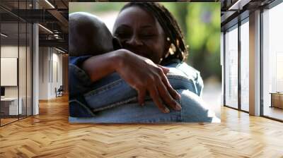 African people hugging, woman running towards partner hugs and embrace Wall mural