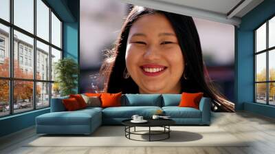 Asian young woman, larger sizer Japanese descent lady smiling outdoors Wall mural