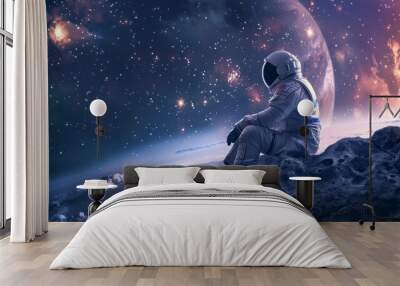 astronaut sitting on a desert planet at night looking at the sky Wall mural