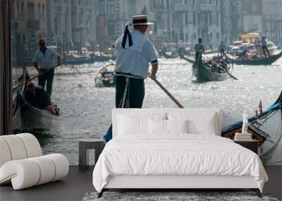 Venice gondolas at Rialto Bridge.  Gondolas near Rialto bridge in Venice, in the background the Grand Canal and the ancient buildings typical of this city. Tourism and travel  Wall mural