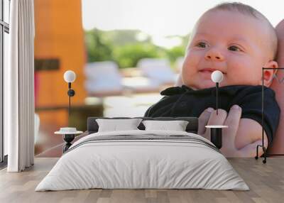 Baby boy portrait outside by the pool Wall mural