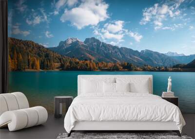 beautiful fairytale landscape in autumn with mountains in the background and a blue lake Wall mural