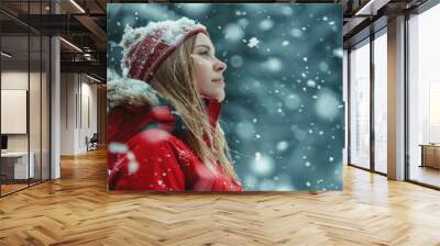 beautiful woman in red coat in the snow in winter Wall mural