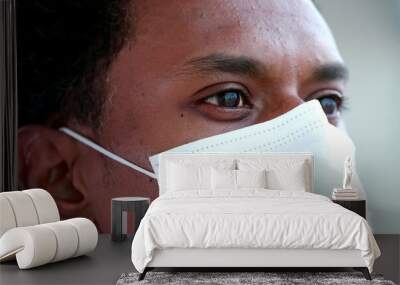 Close-up black man face wearing covid-19 mask, african person coronavirus Wall mural