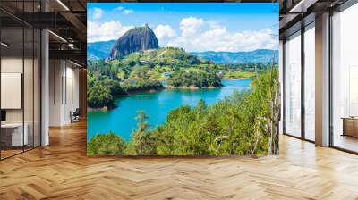 Colombia Guatape,  landscape view of Penol lake and the famous homonym big rock in a sunny day with blue sky a famous tourist destination Wall mural