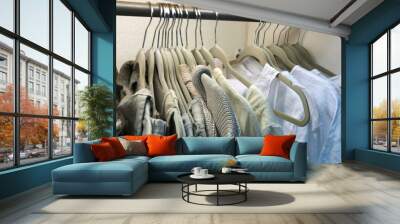 Colorful clothes on hangers Wall mural