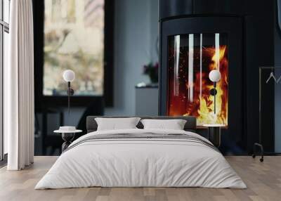 Cozy house chimney fire place fire burning in a modern interior Wall mural