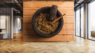 Green sauce of green tomatoes, serrano chile, onion, salt and lemon, served in a molcajete, with a wooden spoon to serve it, this sauce is used in Mexico to accompany different dishes such as tacos. 2 Wall mural