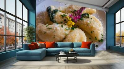 half moon shaped meat ravioli, topped with fresh flowers and parmesan Wall mural