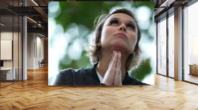 Hopeful woman looking up at sky smiling praying with HOPE and FAITH Wall mural