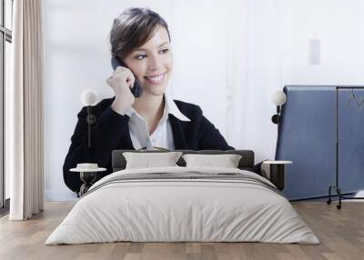 young woman working in office with telephone Wall mural