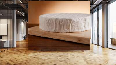 camembert on wood background Wall mural