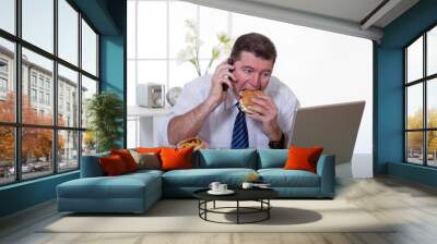 man at office with phone eat unhealthy food Wall mural