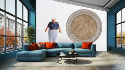 miniature of an obese man with a 2 euro coin Wall mural