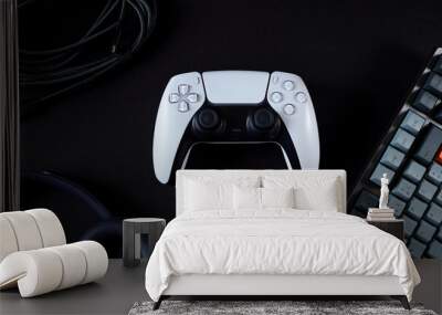 Modern gamepad surrounded by tech products Wall mural