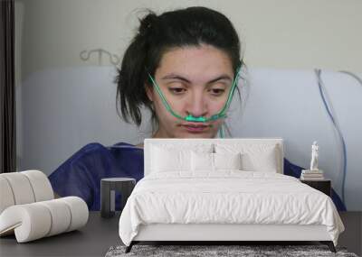 Patient woman at hospital, real life female patient in bed Wall mural