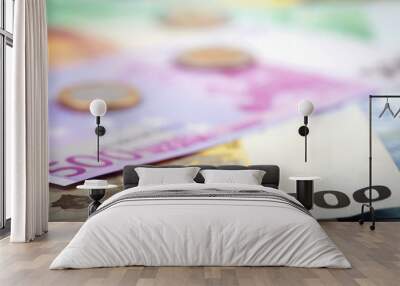 Closeup of euro banknotes and coins Wall mural