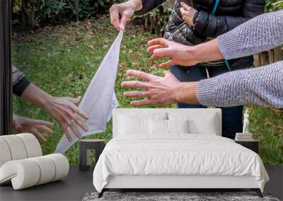 A flag-stealing game action with the hands of two players trying to grab the flag Wall mural