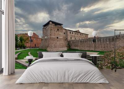 The ancient Castel Sismondo in the historic center of Rimini, Italy, under a dramatic sky Wall mural