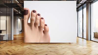 Woman feet on white towel, closeup Wall mural