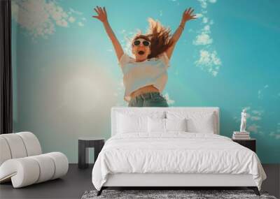 woman jumping with sky background Wall mural