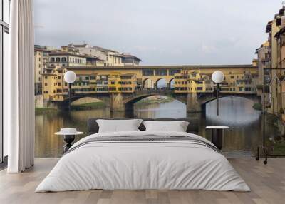 Ponte Vecchio the famous Arch bridge in Florence on Arno river, Tuscany, Italy Wall mural