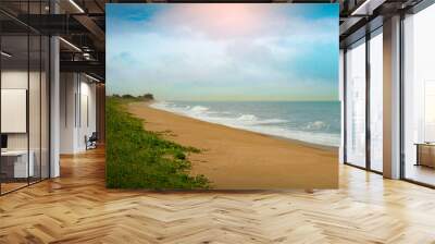 Deserted beach with sunset and blue sky in Marataízes ES Wall mural