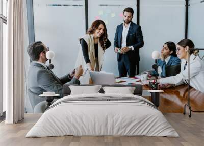 Group of latin business people or teamwork working using laptop at the office in Mexico Latin America, hispanic people
 Wall mural