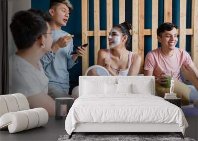 Latin LGBT Friends using Facial mask and cosmetics treatments on bed at home in Mexico, Hispanic homosexual and lgbtq community in Latin America Wall mural