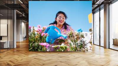 Mexican woman gardening in a home terrace in Mexico city Wall mural