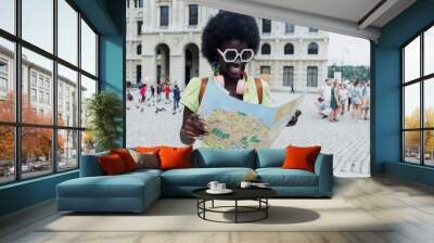 young tourist afro american woman holding a map, young caribbean girl on holidays in Latin America Wall mural