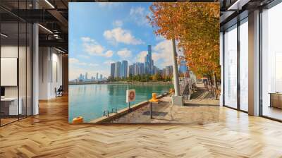 A beautiful autumn landscape on the banks of Lake Michigan at Navy Pier, autumn trees, people walking, skyscrapers, hotels and office buildings in the city skyline in Chicago Illinois USA Wall mural