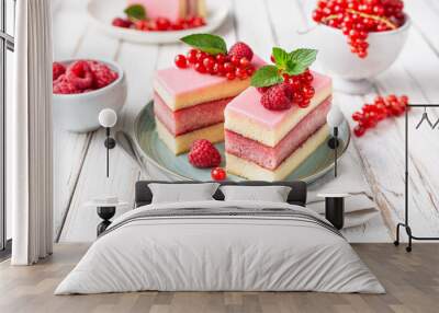 Delicious and refreshing juicy dessert, punch cake topped with sugar icing and fresh raspberries and red currants Wall mural