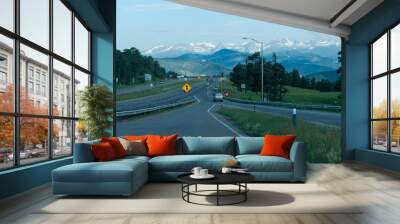 Merging onto highway with mountains in view in windshield Wall mural