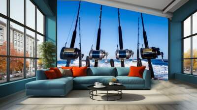 Collection of fishing rods in a boat at the Caribbean Wall mural