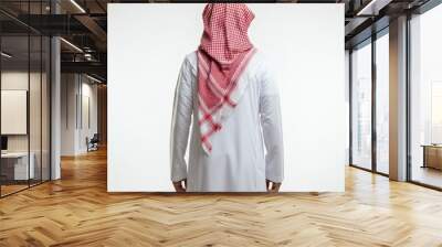 Back view of an Arab man in thobe standing on white isolated background Wall mural