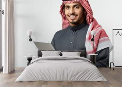 Portrait of Arab businessman holding digital tablet
 Wall mural