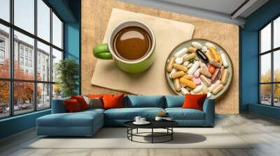 breakfast for a supplement junkie - vitamin pills, capsules and tablets in a small bowl with a cup of coffee - healthy lifestyle, overdose or addiction concept Wall mural