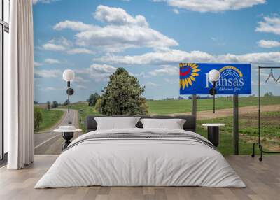 Kansas welcomes you - welcome roadside sign with a popular Latin phrase ad astra per aspera (through hardships to the stars), driving and travel concept Wall mural