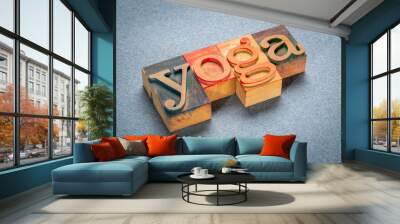 yoga word - text in letterpress wood type printing blocks stained by color inks on art paper Wall mural