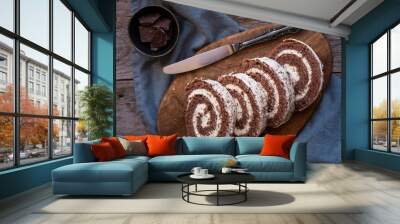 Delicious chocolate roll cake with white cream, homemade baked dessert Wall mural