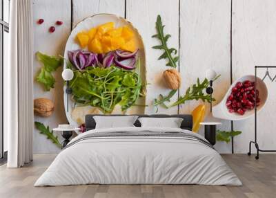 salad with rucola and pomegranate seeds Wall mural