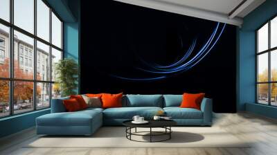 Frozen blue light in total darkness. Light blue semicircles. Abstract photography Wall mural